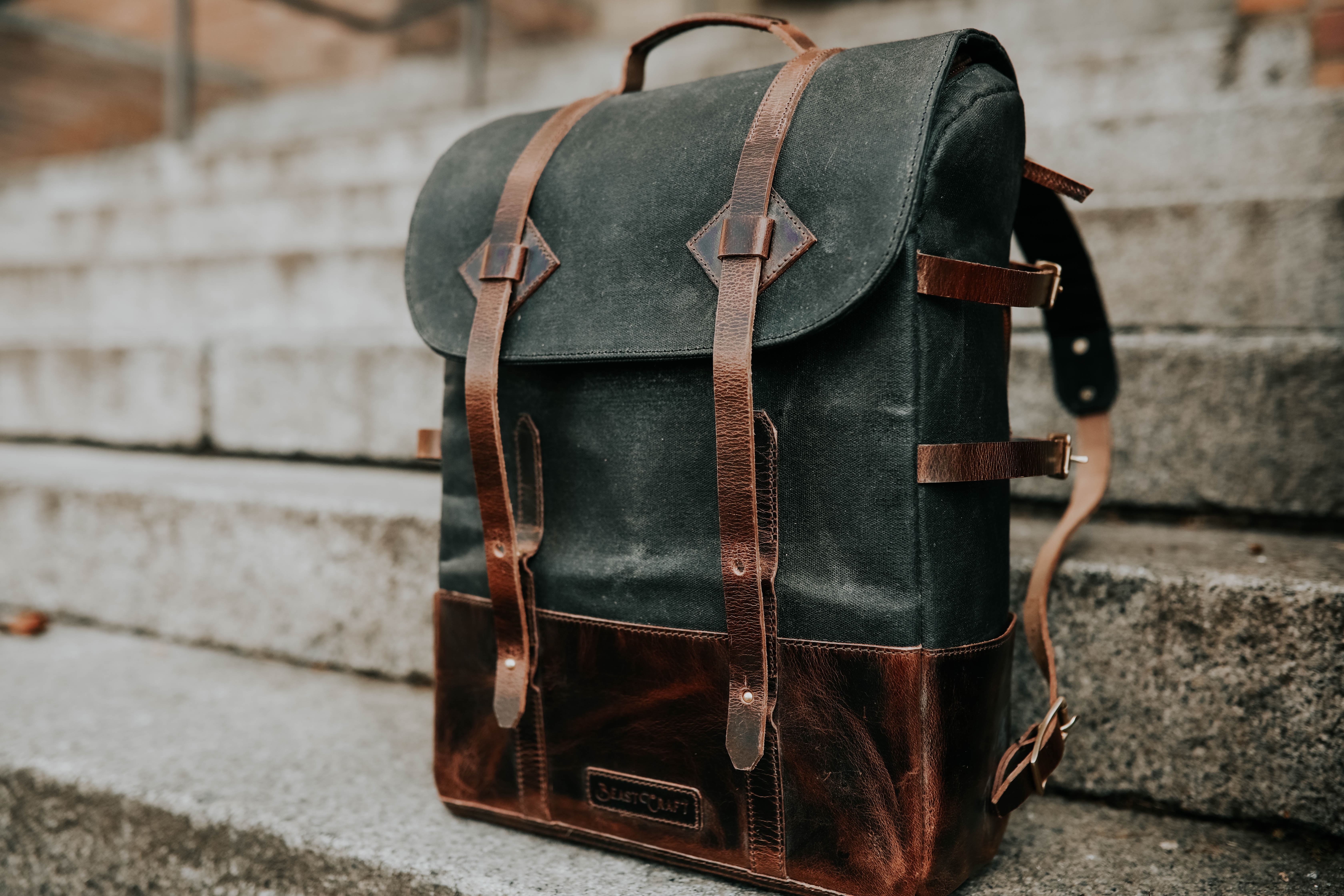 Backpack at the bottom of a set of stairs | Photo by Lina Verovaya on Unsplash
